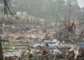 Storm damaged homes and broken trees are seen Thursday, April 3, 2025, in Selmer, Tenn. (AP Photo/George Walker IV)