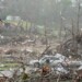 Storm damaged homes and broken trees are seen Thursday, April 3, 2025, in Selmer, Tenn. (AP Photo/George Walker IV)