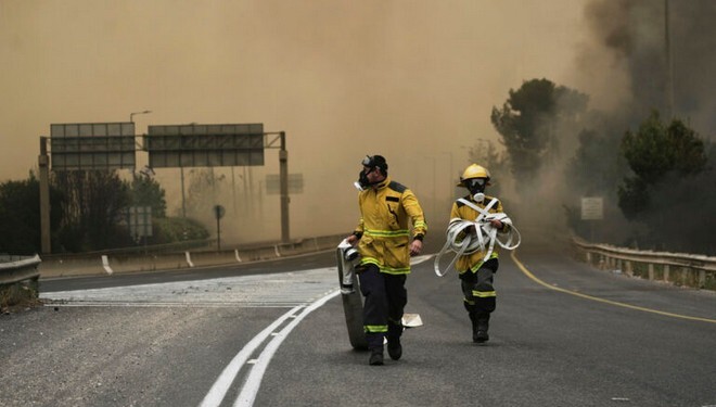Israeli firefighters work to extinguish a forest fire burning near Jerusalem, Wednesday, April 30, 2025. (AP Photo/Mahmoud Illean)