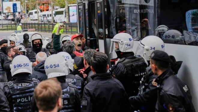 A union member shouts slogans as he is detained by Turkish police officers during Labor Day celebrations in Istanbul, Turkey, Thursday, May 1, 2025. (AP Photo/Khalil Hamra)