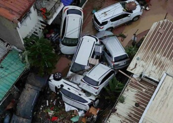 Cars are piled on top of each other after flooding caused by Typhoon Kalmaegi in Cebu city, central Philippines, Tuesday, Nov. 4, 2025. (AP Photo/Jacqueline Hernandez)