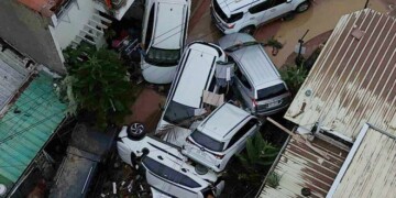 Cars are piled on top of each other after flooding caused by Typhoon Kalmaegi in Cebu city, central Philippines, Tuesday, Nov. 4, 2025. (AP Photo/Jacqueline Hernandez)