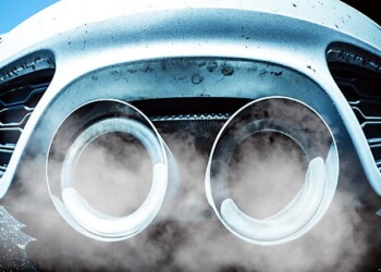 Smoking exhaust pipes of a car with combustion engine